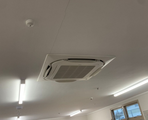 ARFNZ/RCR Ceiling AC inside a highschool classroom