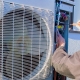 A worker improving heat pump performance