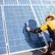 Worker doing maintenance on a solar array